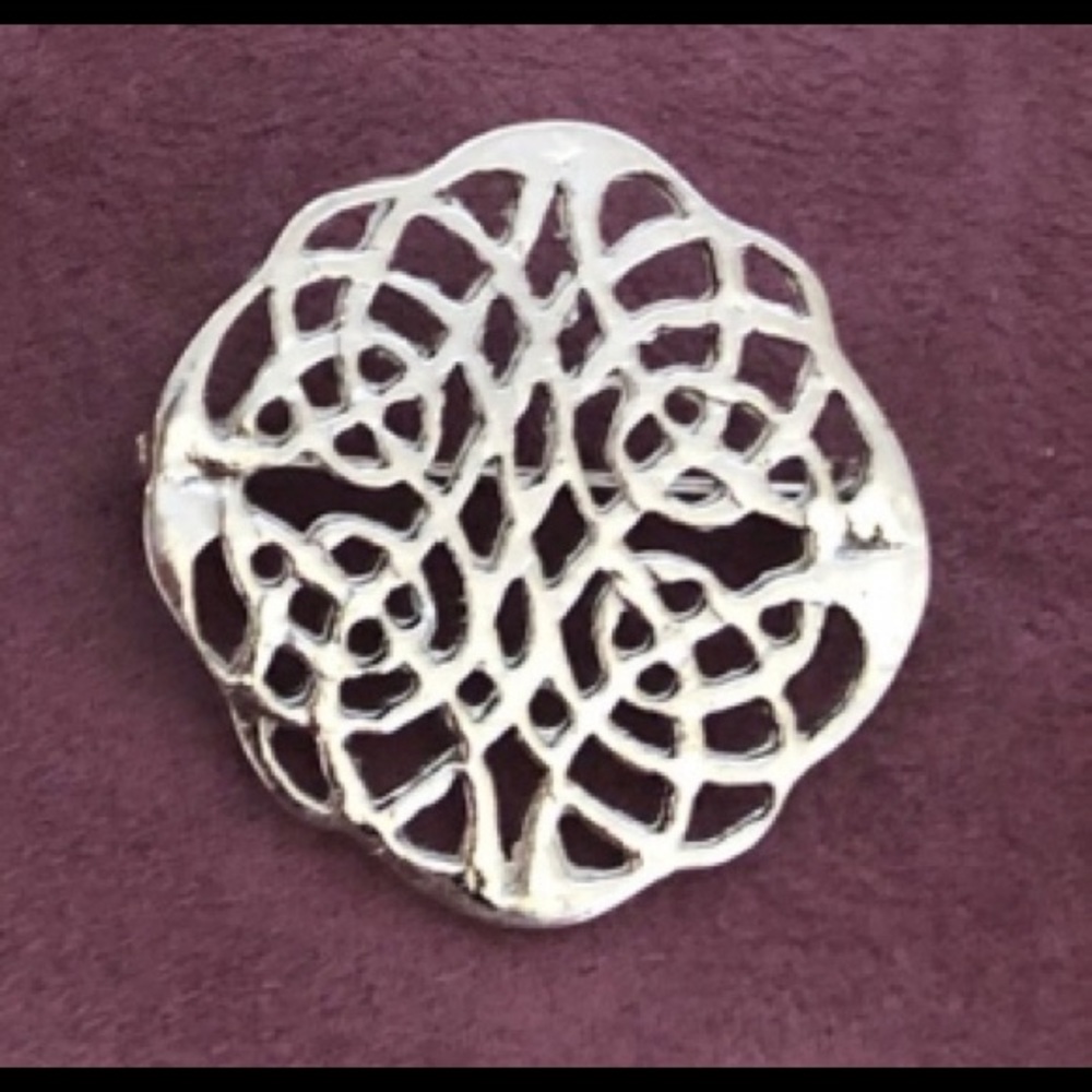 Four decorative pins